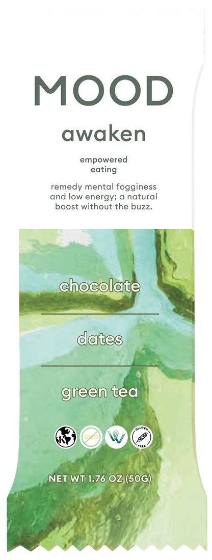 Awaken Mood Bar with chocolate, dates and green tea in swirly green packing on a white background.